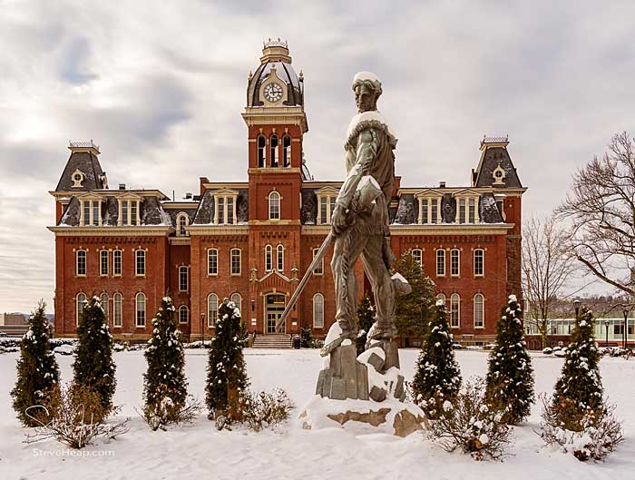 Mountaineer Statue against Woodburn Hall